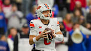 Nov 1, 2025; Lawrence, Kansas, USA; Oklahoma State Cowboys quarterback Zane Flores (6) drops back to pass during the second half against the Kansas Jayhawks at David Booth Kansas Memorial Stadium. Mandatory Credit: Jay Biggerstaff-Imagn Images