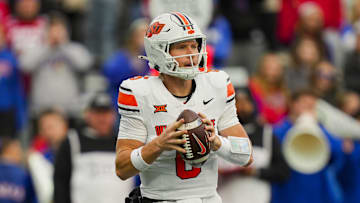 Nov 1, 2025; Lawrence, Kansas, USA; Oklahoma State Cowboys quarterback Zane Flores (6) drops back to pass during the second half against the Kansas Jayhawks at David Booth Kansas Memorial Stadium. Mandatory Credit: Jay Biggerstaff-Imagn Images