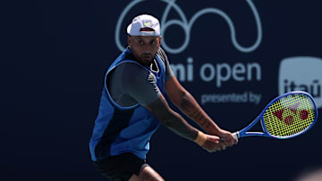 Nick Kyrgios hits a backhand