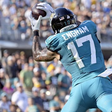 Oct 27, 2024; Jacksonville, Florida, USA; Jacksonville Jaguars tight end Evan Engram (17) catches a touchdown pass during the fourth quarter against the Green Bay Packers at EverBank Stadium. 