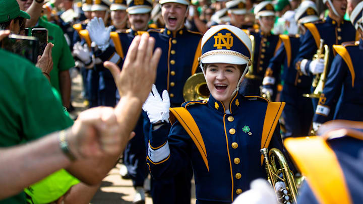 Members of the band high five fans before the Notre Dame vs. California NCAA football game Saturday, Sept. 17, 2022 at Notre Dame Stadium in South Bend