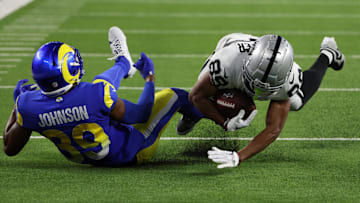 Aug 19, 2023; Inglewood, California, USA;  Las Vegas Raiders wide receiver Tre Tucker (89) catches a pass against Los Angeles Rams safety Quindell Johnson (39) during the fourth quarter at SoFi Stadium. Mandatory Credit: Kiyoshi Mio-Imagn Images