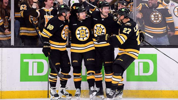 Sep 29, 2026; Boston, Massachusetts, USA;  Boston Bruins forward JJ Peterka celebrates his goal with right wing David Pastrnak (88) defenseman Will Borgen (17) and defenseman Hampus Lindholm (27) during the third period against the New York Rangers at TD Garden. Mandatory Credit: Bob DeChiara-Imagn Images