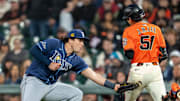 San Francisco Giants center fielder Jung Hoo Lee (51) is tagged out by Tampa Bay Rays first baseman Bob Seymour Friday night.