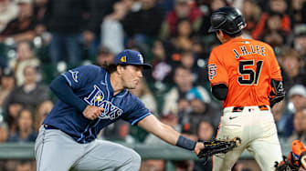 San Francisco Giants center fielder Jung Hoo Lee (51) is tagged out by Tampa Bay Rays first baseman Bob Seymour Friday night.