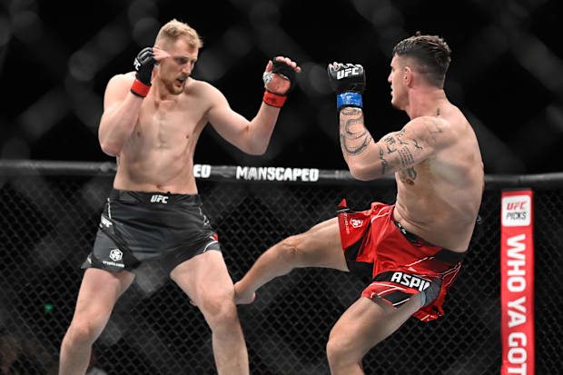 Alexander Volkov (red gloves) and Tom Aspinall (blue gloves) during UFC Fight Night at O2 Arena. 