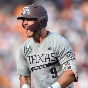 Texas A&M's Gavin Grahovac (9) celebrates an RBI-single during game three of the NCAA College World Series finals between Tennessee and Texas A&M at Charles Schwab Field in Omaha, Neb., on Monday, June 24, 2024.