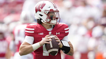 Sep 6, 2025; Madison, Wisconsin, USA; Wisconsin Badgers quarterback Danny O'Neil (18) warms up before a game against the Middle Tennessee Blue Raiders at Camp Randall Stadium. Mandatory Credit: Kayla Wolf-Imagn Images