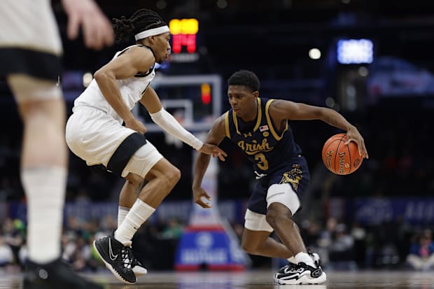 Burton (right) is a star for the Fighting Irish.