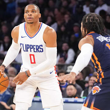 Nov 6, 2023; New York, New York, USA; Los Angeles Clipper point guard Russell Westbrook (0) dribbles the ball against New York Knicks point guard Jalen Brunson (11) during the fourth quarter at Madison Square Garden. Mandatory Credit: Gregory Fisher-Imagn Images