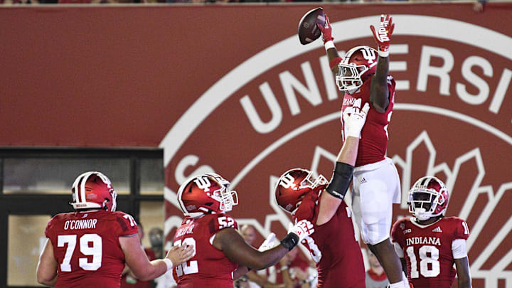 Sep 11, 2021; Bloomington, Indiana, USA; Indiana Hoosiers running back Davion Ervin-Poindexter (22) celebrates with teammates after scoring a touchdown against the Idaho Vandals during the second half at Memorial Stadium. Indiana won 56-14. Mandatory Credit: Marc Lebryk-Imagn Images