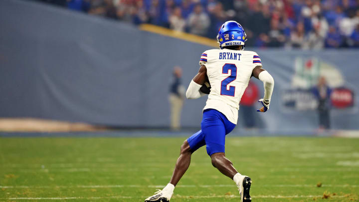 Dec 26, 2023; Phoenix, AZ, USA; Kansas Jayhawks cornerback Cobee Bryant (2) runs with the ball after an interception during the second quarter against the UNLV Rebels in the Guaranteed Rate Bowl at Chase Field. Mandatory Credit: Mark J. Rebilas-USA TODAY Sports