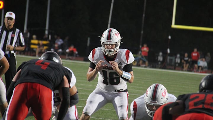 Boone's Jude Baumgardner waits for the snap on Friday, Sept. 27, 2024, at Tiger Stadium in Adel.