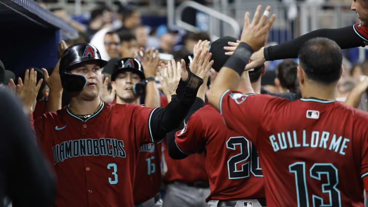 Aug 21, 2024; Miami, Florida, USA;  Arizona Diamondbacks designated hitter Joc Pederson (3) is greeted in the dugout by teammates after scoring against the Miami Marlins in the seventh inning at loanDepot Park. Mandatory Credit: Rhona Wise-USA TODAY Sports