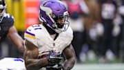 Nov 5, 2023; Atlanta, Georgia, USA; Minnesota Vikings running back Cam Akers (31) runs with the ball against the Atlanta Falcons at Mercedes-Benz Stadium.