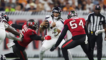 Sep 15, 2025; Houston, Texas, USA; Houston Texans quarterback C.J. Stroud (7) comes under pressure from Tampa Bay Buccaneers linebacker Lavonte David (54) and Tampa Bay Buccaneers linebacker Haason Reddick (5) during the third quarter at NRG Stadium. Mandatory Credit: Troy Taormina-Imagn Images