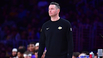 January 15, 2025; Los Angeles, California, USA; Los Angeles Lakers head coach JJ Redick watches game action against the Miami Heat during the first half at Crypto.com Arena. Mandatory Credit: Gary A. Vasquez-Imagn Images