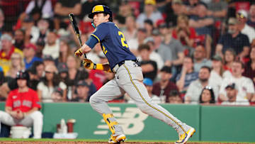 May 24, 2024; Boston, Massachusetts, USA; Milwaukee Brewers designated hitter Christian Yelich (22) runs out a single against the Boston Red Sox during the ninth inning at Fenway Park. Mandatory Credit: Gregory Fisher-USA TODAY Sports