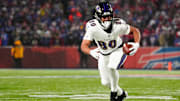 Jan 19, 2025; Orchard Park, New York, USA; Baltimore Ravens tight end Isaiah Likely (80) runs the ball after making a catch during the first quarter against the Buffalo Bills in a 2025 AFC divisional round game at Highmark Stadium. 