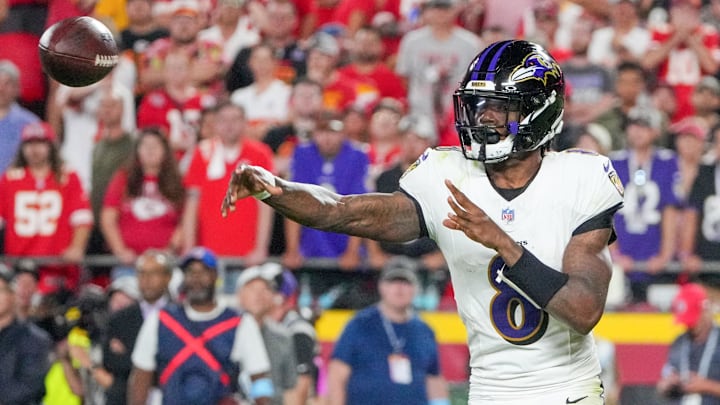 Baltimore Ravens quarterback Lamar Jackson (8) throws a pass against the Kansas City Chiefs during the second half at GEHA Field at Arrowhead Stadium. 