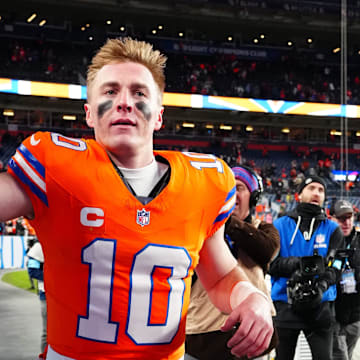 Jan 5, 2025; Denver, Colorado, USA; Denver Broncos quarterback Bo Nix (10) following the win against the Kansas City Chiefs at Empower Field at Mile High. Mandatory Credit: Ron Chenoy-Imagn Images