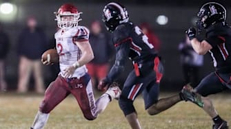 Knox Myles McLaughlin (2) runs the ball Friday, Nov. 21, 2025, during a game between the Bishop Luers Knights and Knox at Bishop Luers High School in Fort Wayne, Ind. The Knights won, 35-0.
