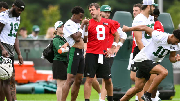 Wide receiver talks with quarterback.