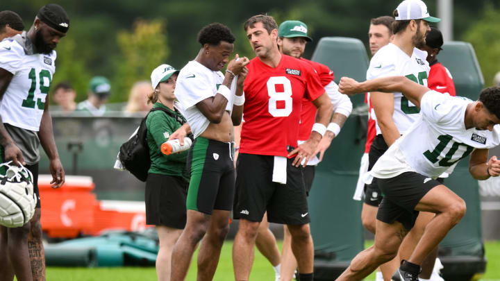 Jul 25, 2024; Florham Park, NJ; New York Jets quarterback Aaron Rodgers (8) talks with wide receiver Garrett Wilson (5) during training camp at Atlantic Health Jets Training Center.  