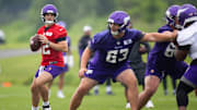 Max Brosmer (12) throwing at Vikings offseason workouts