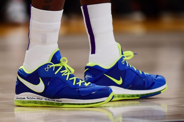 LeBron James' purple and green Nike sneakers.