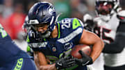 Oct 20, 2025; Seattle, Washington, USA; Seattle Seahawks running back Zach Charbonnet (26) runs for a touchdown during the third quarter against the Houston Texans at Lumen Field. Mandatory Credit: Steven Bisig-Imagn Images