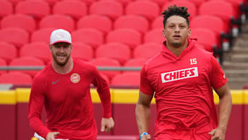 Aug 22, 2024; Kansas City, Missouri, USA; Kansas City Chiefs quarterback Patrick Mahomes (15) and quarterback Carson Wentz (11) warm up against the Chicago Bears prior to a game at GEHA Field at Arrowhead Stadium. Mandatory Credit: Denny Medley-Imagn Images