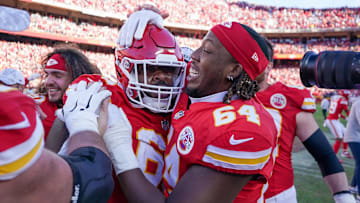 Nov 10, 2024; Kansas City, Missouri, USA; Kansas City Chiefs offensive tackle Wanya Morris (64) celebrates with defensive tackle Mike Pennel Jr. (69) after the win over the Denver Broncos at GEHA Field at Arrowhead Stadium. Mandatory Credit: Denny Medley-Imagn Images