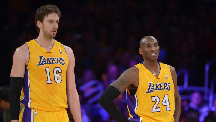 Dec 10, 2013; Los Angeles, CA, USA; Los Angeles Lakers forward Pau Gasol (16) and guard Kobe Bryant (24) react during the game against the Phoenix Suns at Staples Center. The Suns defeated the Lakers 114-108. Mandatory Credit: Kirby Lee-USA TODAY Sports