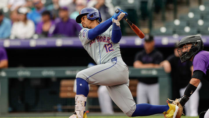 Aug 8, 2024; Denver, Colorado, USA; New York Mets shortstop Francisco Lindor (12) hits a double in the first inning against the Colorado Rockies at Coors Field.