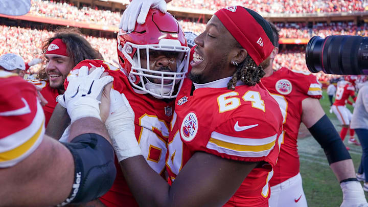 Nov 10, 2024; Kansas City, Missouri, USA; Kansas City Chiefs offensive tackle Wanya Morris (64) celebrates with defensive tackle Mike Pennel Jr. (69) after the win over the Denver Broncos at GEHA Field at Arrowhead Stadium. Mandatory Credit: Denny Medley-Imagn Images