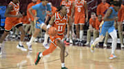 Feb 19, 2025; Tallahassee, Florida, USA; Miami Hurricanes guard AJ Staton-McCray (11) drives up the court during the first half against the Florida State Seminoles at Donald L. Tucker Center. Mandatory Credit: Melina Myers-Imagn Images