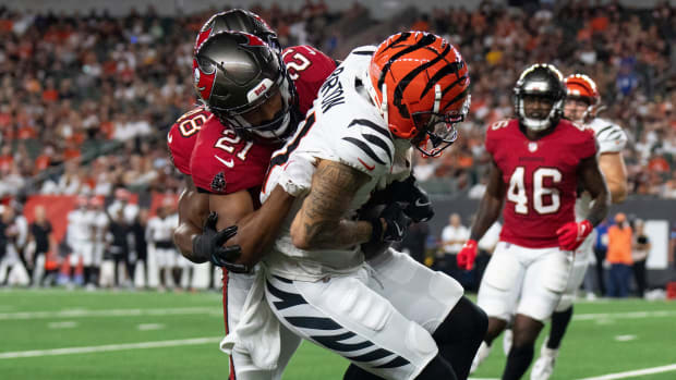 Tampa Bay Buccaneers cornerback Andrew Hayes (21) tackles Cincinnati Bengals wide receiver Jermaine Burton (81) 