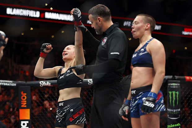 Erin Blanchfield (red gloves) defeats Rose Namajunas (blue gloves) in a women's flyweight bout during UFC Fight Night.