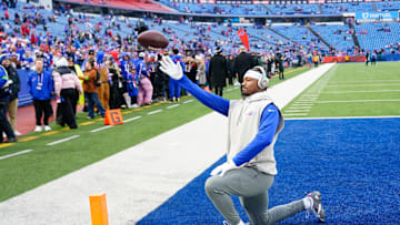 Dec 31, 2023; Orchard Park, New York, USA; Buffalo Bills wide receiver Stefon Diggs (14) plays catch with fans prior to the game against the New England Patriots at Highmark Stadium. Mandatory Credit: Gregory Fisher-Imagn Images