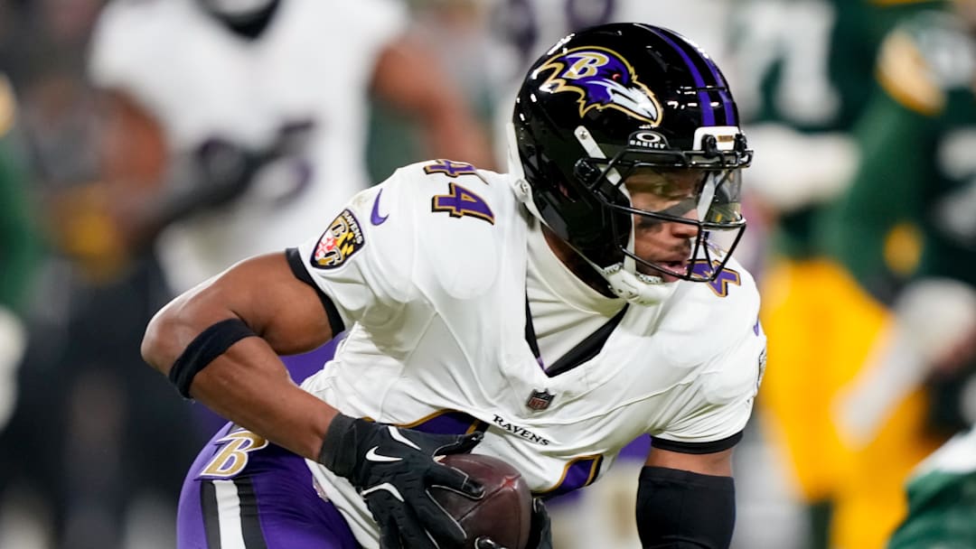 Dec 27, 2025; Green Bay, Wisconsin, USA; Baltimore Ravens cornerback Marlon Humphrey (44) intercepts a pass during the fourth quarter against the Green Bay Packers at Lambeau Field. Mandatory Credit: Kayla Wolf-Imagn Images
