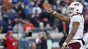 Nov 25, 2023; Charlottesville, Virginia, USA; Virginia Tech Hokies quarterback Kyron Drones (1) celebrates after running for a first down against the Virginia Cavaliers during the first quarter at Scott Stadium. Mandatory Credit: Geoff Burke-USA TODAY Sports