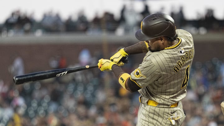 Sep 13, 2024; San Francisco, California, USA;  San Diego Padres first base Luis Arraez (4) hits a single during the first inning against the San Francisco Giants at Oracle Park. Mandatory Credit: Stan Szeto-Imagn Images