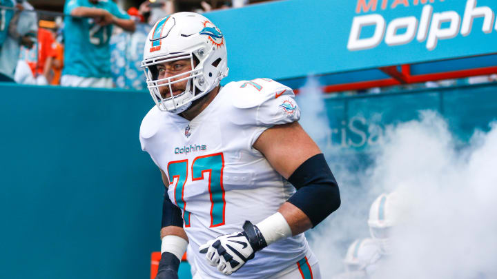 Dec 5, 2021; Miami Gardens, Florida, USA; Miami Dolphins offensive tackle Jesse Davis (77) takes on the field prior the game against the New York Giants at Hard Rock Stadium. Mandatory Credit: Sam Navarro-USA TODAY Sports