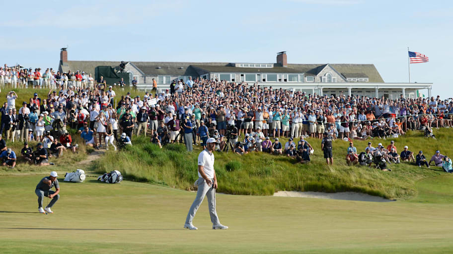 Dustin Johnson and Brooks Koepka play the eighteenth green during the final round of the 2018 U.S. Open at Shinnecock Hills.