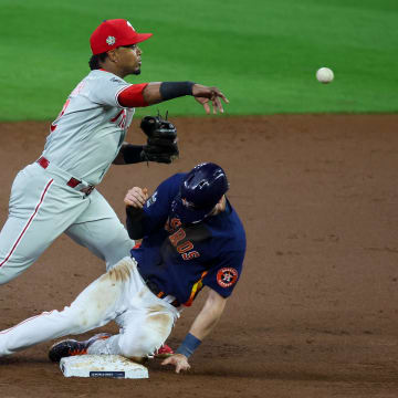 Nov 5, 2022; Houston, Texas, USA; Philadelphia Phillies second baseman Jean Segura (2) forces out Houston Astros right fielder Kyle Tucker (30) and throws to first to complete the double play during the second inning in game six of the 2022 World Series at Minute Maid Park. 