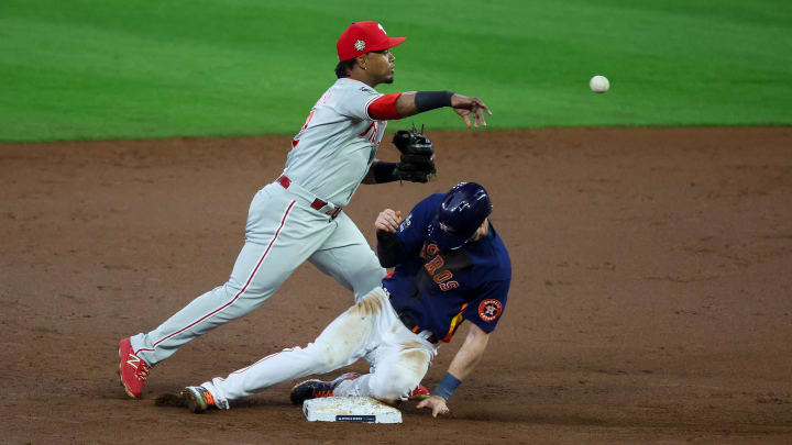 Nov 5, 2022; Houston, Texas, USA; Philadelphia Phillies second baseman Jean Segura (2) forces out Houston Astros right fielder Kyle Tucker (30) and throws to first to complete the double play during the second inning in game six of the 2022 World Series at Minute Maid Park. 