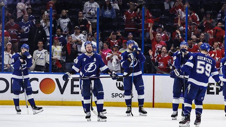 May 3, 2026; Tampa, Florida, USA; Tampa Bay Lightning forward Brandon Hagel (38), forward Nikita Kucherov (86), forward Brayden Point (21), forward Zemgas Girgensons (28), and forward Jake Guentzel (59) react to losing to the Montreal Canadiens in game seven of the first round of the 2026 Stanley Cup Playoffs at Benchmark International Arena. Mandatory Credit: Morgan Tencza-Imagn Images