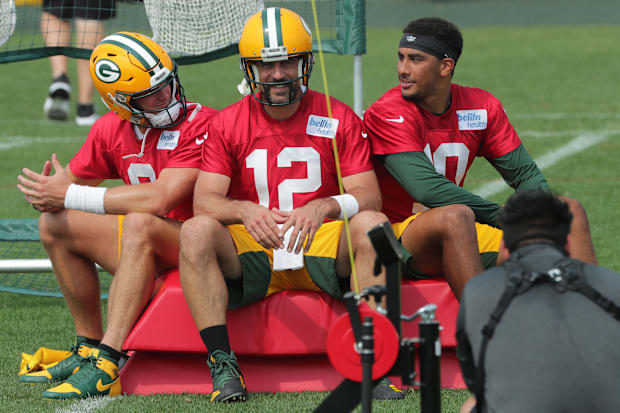 Green Bay Packers quarterback Aaron Rodgers (12) is shown with backups Tim Boyle and Jordan Love in 2020.