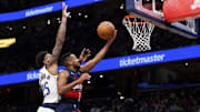 Nov 8, 2025; Washington, District of Columbia, USA; Washington Wizards guard CJ McCollum (3) shoots the ball as Dallas Mavericks forward P.J. Washington (25) defends in the second half at Capital One Arena. Mandatory Credit: Geoff Burke-Imagn Images